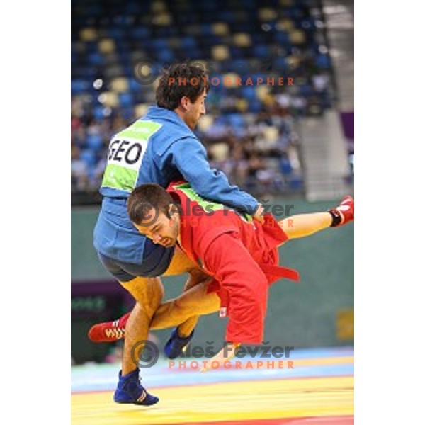 Tadej Cutuk (SLO, red) fights with Kakha Mamulashvili (GEO,blue) in eight-finals of Sambo Men\'s - 74 kg at First European Games Baku 2015 in Heydar Aliyev Arena in Baku, Azerbaijan on June 22, 2015