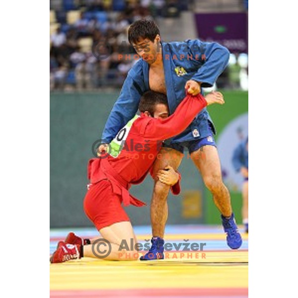 Tadej Cutuk (SLO, red) fights with Kakha Mamulashvili (GEO,blue) in eight-finals of Sambo Men\'s - 74 kg at First European Games Baku 2015 in Heydar Aliyev Arena in Baku, Azerbaijan on June 22, 2015