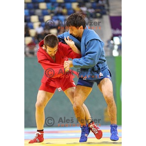 Tadej Cutuk (SLO, red) fights with Kakha Mamulashvili (GEO,blue) in eight-finals of Sambo Men\'s - 74 kg at First European Games Baku 2015 in Heydar Aliyev Arena in Baku, Azerbaijan on June 22, 2015