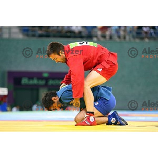 Tadej Cutuk (SLO, red) fights with Kakha Mamulashvili (GEO,blue) in eight-finals of Sambo Men\'s - 74 kg at First European Games Baku 2015 in Heydar Aliyev Arena in Baku, Azerbaijan on June 22, 2015