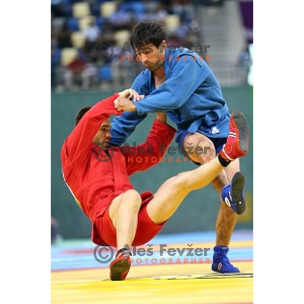 Tadej Cutuk (SLO, red) fights with Kakha Mamulashvili (GEO,blue) in eight-finals of Sambo Men\'s - 74 kg at First European Games Baku 2015 in Heydar Aliyev Arena in Baku, Azerbaijan on June 22, 2015