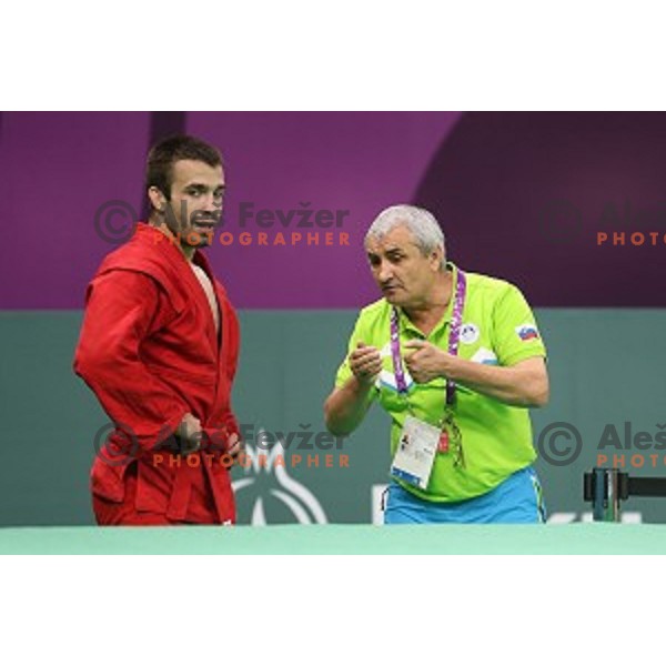 Tadej Cutuk (SLO, red) fights with Kakha Mamulashvili (GEO,blue) in eight-finals of Sambo Men\'s - 74 kg at First European Games Baku 2015 in Heydar Aliyev Arena in Baku, Azerbaijan on June 22, 2015