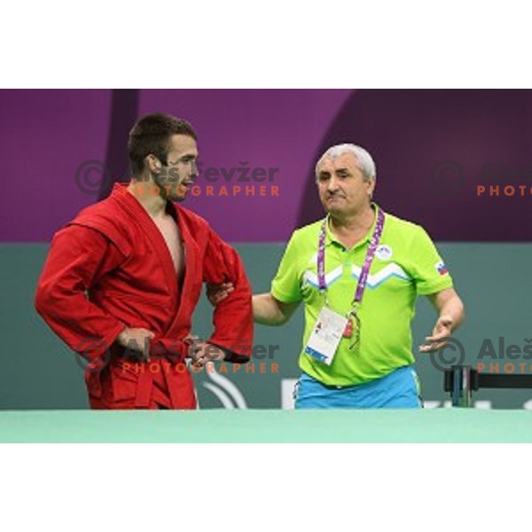 Tadej Cutuk (SLO, red) fights with Kakha Mamulashvili (GEO,blue) in eight-finals of Sambo Men\'s - 74 kg at First European Games Baku 2015 in Heydar Aliyev Arena in Baku, Azerbaijan on June 22, 2015