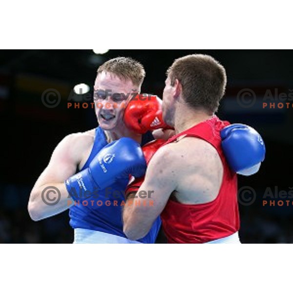 Aljaz Venko (red trunks) of Slovenia fights Michael O\'Rielly (blue trunks) in quarterfinals of Boxing tournament in Crystal Hall during First European Games Baku 2015, Azerbaijan on June 24, 2015
