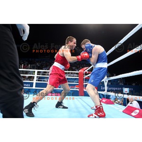 Aljaz Venko (red trunks) of Slovenia fights Michael O\'Rielly (blue trunks) in quarterfinals of Boxing tournament in Crystal Hall during First European Games Baku 2015, Azerbaijan on June 24, 2015