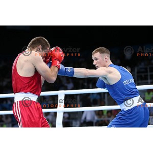 Aljaz Venko (red trunks) of Slovenia fights Michael O\'Rielly (blue trunks) in quarterfinals of Boxing tournament in Crystal Hall during First European Games Baku 2015, Azerbaijan on June 24, 2015