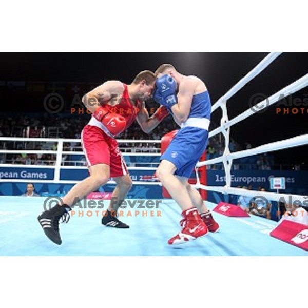 Aljaz Venko (red trunks) of Slovenia fights Michael O\'Rielly (blue trunks) in quarterfinals of Boxing tournament in Crystal Hall during First European Games Baku 2015, Azerbaijan on June 24, 2015