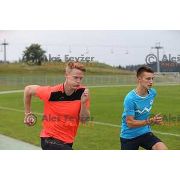 Luka Janezic and Gregor Grahovac during practice session at Rogla ( 1511m altitude ) , Slovenia on July 16, 2015