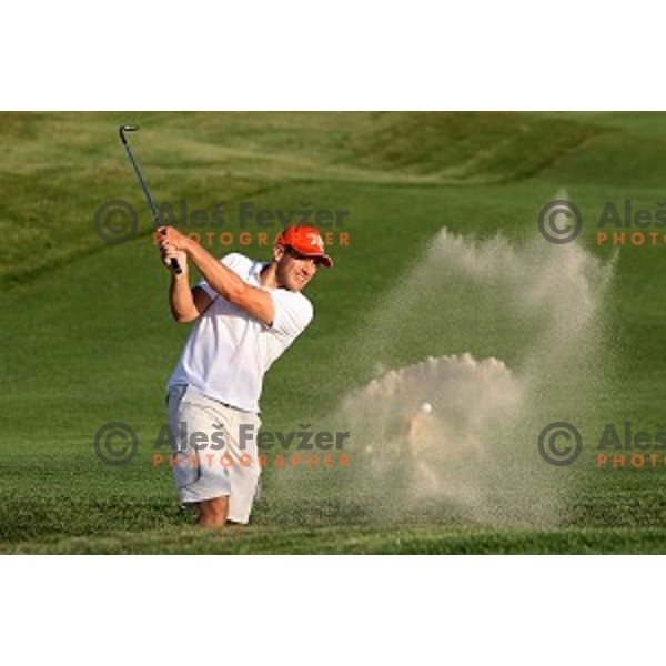 Jure Kosir playing out of bunker during golf tournament at Diners golf course, Smlednik ,Slovenia on September 15, 2009
