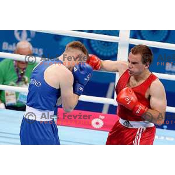 Aljaz Venko (red trunks) of Slovenia fights Michael O\'Rielly (blue trunks) in quarterfinals of Boxing tournament in Crystal Hall during First European Games Baku 2015, Azerbaijan on June 24, 2015