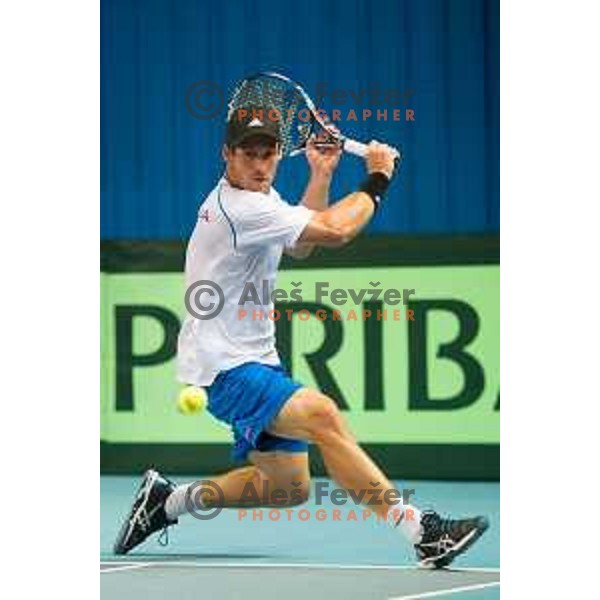 Grega Zemlja of Slovenia in action during Davis Cup match between Slovenia and Lithuania in Kranj, Slovenia on October 30, 2015.