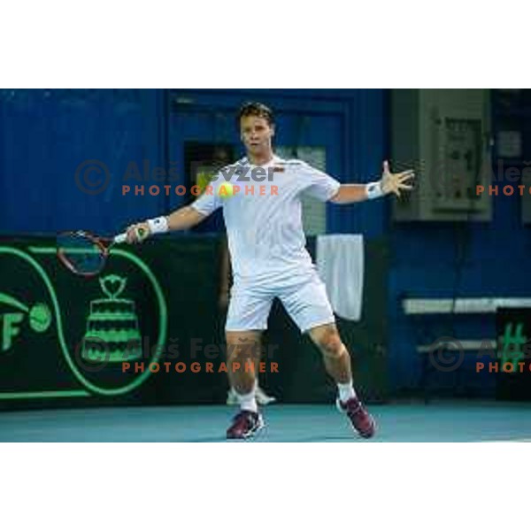 Ricardas Berankkis of Lithuania in action during Davis Cup match between Slovenia and Lithuania in Kranj, Slovenia on October 30, 2015.