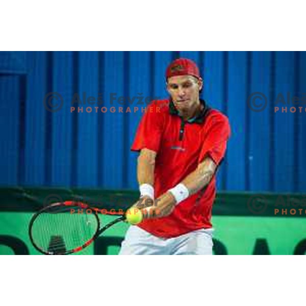 Blaz Rola of Slovenia in action during Davis Cup match between Slovenia and Lithuania in Kranj, Slovenia on October 30, 2015.