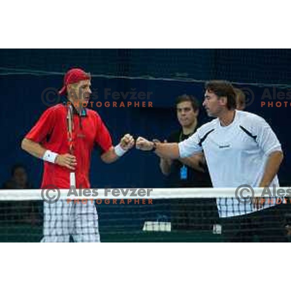 Blaz Rola and Blaz Trupej, captain of Slovenia in action during Davis Cup match between Slovenia and Lithuania in Kranj, Slovenia on October 30, 2015.