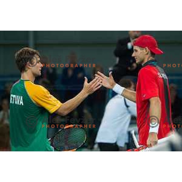 Laurinas Grigelis of Lithuania and Blaz Rola of Slovenia in action during Davis Cup match between Slovenia and Lithuania in Kranj, Slovenia on October 30, 2015.