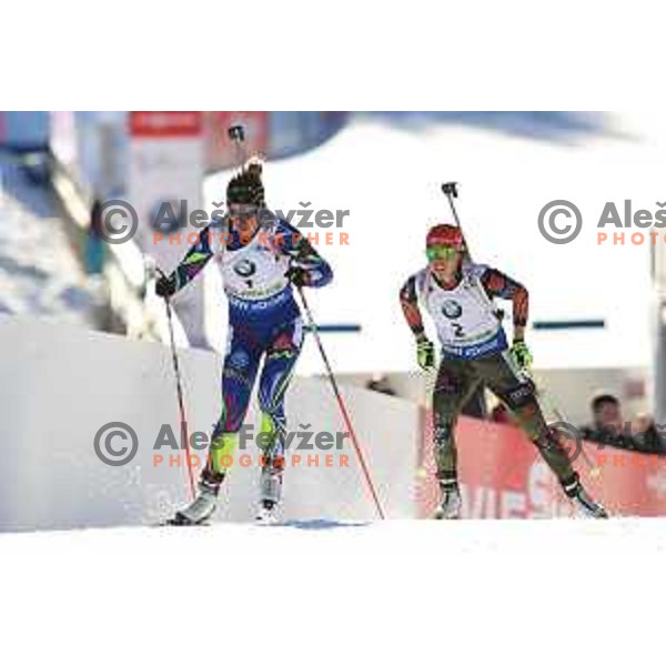 Laura Dahlmeier and Marie Dorin Herbert during BMW IBU World Cup Biathlon Women Pursuit 10km at Pokljuka, Slovenia on December 19, 2015