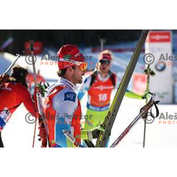 Klemen Bauer and Jakov Fak during BMW IBU World Cup Biathlon Men Pursuit 12.5km at Pokljuka, Slovenia on December 19, 2015