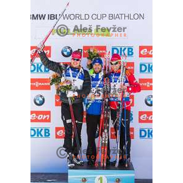 Emil Hegle Svendsen, Jean Guillaume Beatrix and Ole Einar Bjorendalen on podium during BMW IBU World Cup Biathlon Men Mass Start 15km at Pokljuka, Slovenia on December 20, 2015