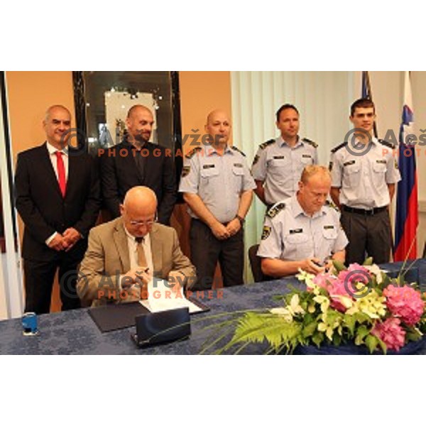 Bogdan Gabrovec, president of Slovenian Olympic Committee signs contract with Marjan Fank, general manager of Slovenian Police in Ljubljana, Slovenia on May 26, 2016