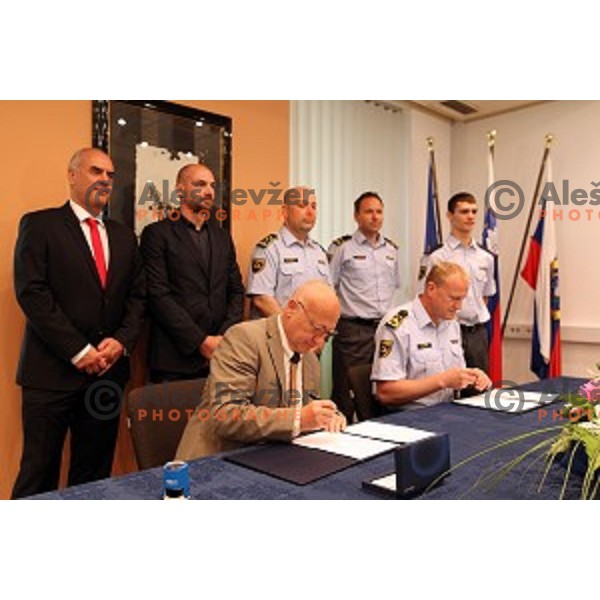 Bogdan Gabrovec, president of Slovenian Olympic Committee signs contract with Marjan Fank, general manager of Slovenian Police in Ljubljana, Slovenia on May 26, 2016