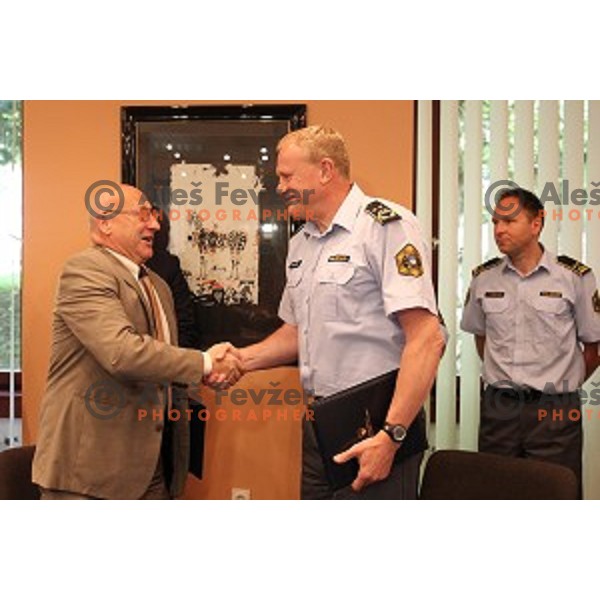 Bogdan Gabrovec, president of Slovenian Olympic Committee signs contract with Marjan Fank, general manager of Slovenian Police in Ljubljana, Slovenia on May 26, 2016
