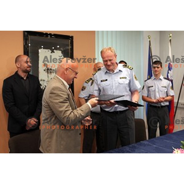 Bogdan Gabrovec, president of Slovenian Olympic Committee signs contract with Marjan Fank, general manager of Slovenian Police in Ljubljana, Slovenia on May 26, 2016