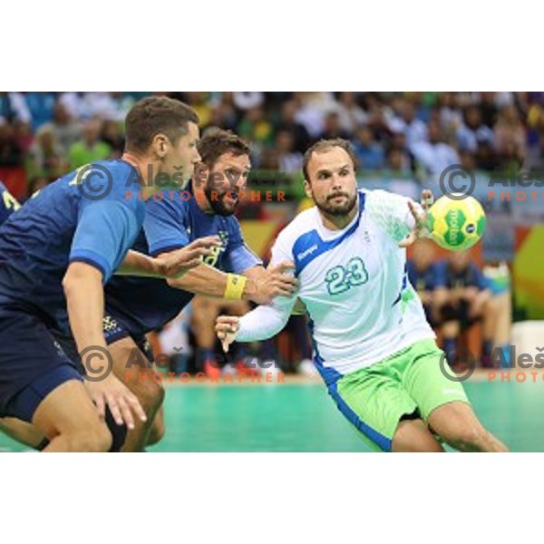 Uros Zorman of Slovenia in action during Olympic handball tournament match between Slovenia and Sweden in Barra Olympic Park at Rio de Janeiro 2016 Olympic games , Brazil on August 11 , 2016