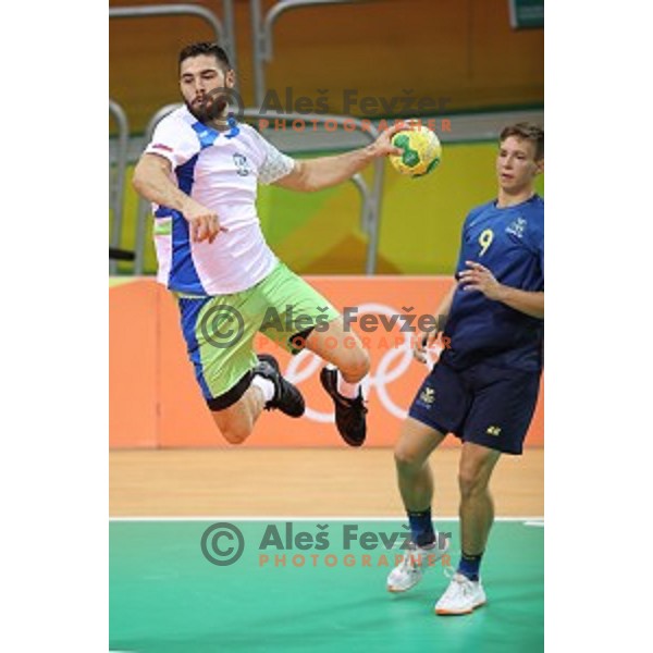 Blaz Janc of Slovenia in action during Olympic handball tournament match between Slovenia and Sweden in Barra Olympic Park at Rio de Janeiro 2016 Olympic games , Brazil on August 11 , 2016