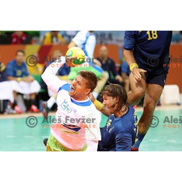 Marko Bezjak of Slovenia in action during Olympic handball tournament match between Slovenia and Sweden in Barra Olympic Park at Rio de Janeiro 2016 Olympic games , Brasil on August 12 , 2016