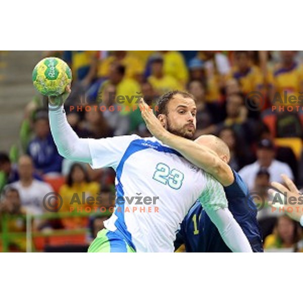 Uros Zorman of Slovenia in action during Olympic handball tournament match between Slovenia and Sweden in Barra Olympic Park at Rio de Janeiro 2016 Olympic games , Brazil on August 11 , 2016