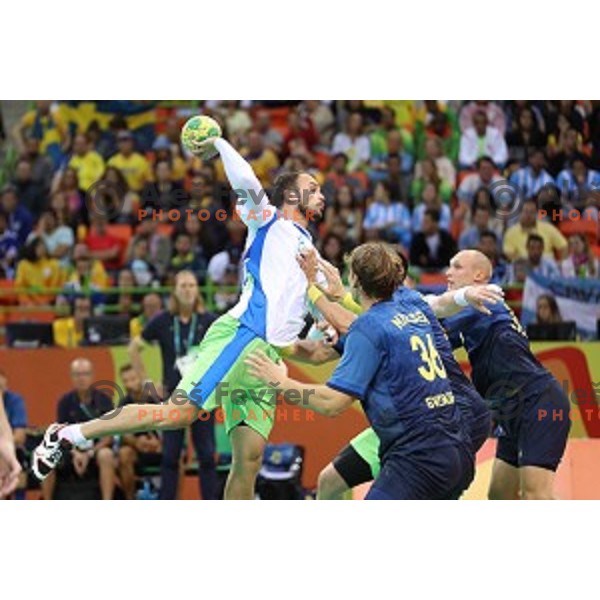 Uros Zorman of Slovenia in action during Olympic handball tournament match between Slovenia and Sweden in Barra Olympic Park at Rio de Janeiro 2016 Olympic games , Brazil on August 11 , 2016