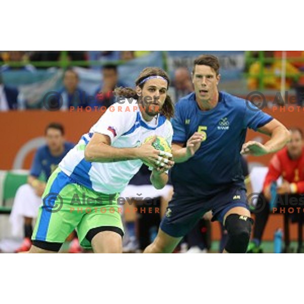 Dean Bombac of Slovenia in action during Olympic handball tournament match between Slovenia and Sweden in Barra Olympic Park at Rio de Janeiro 2016 Olympic games , Brazil on August 11 , 2016