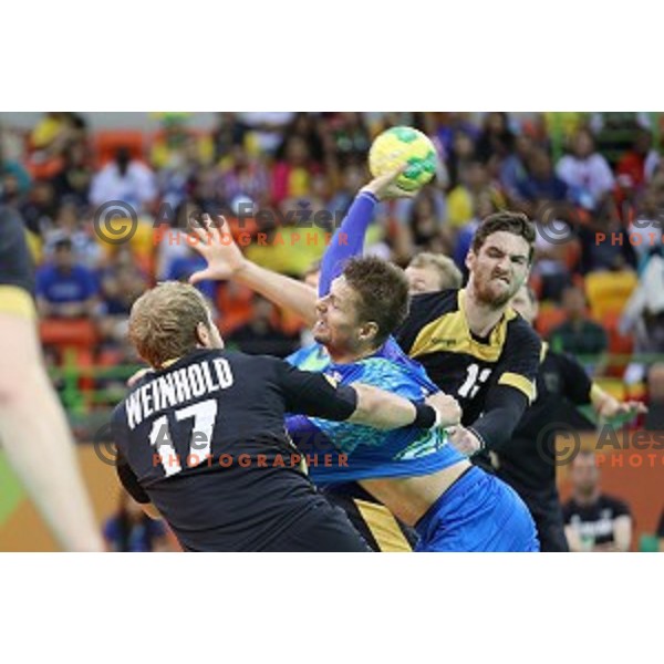 Marko Bezjak of Slovenia in action during Olympic handball tournament match between Slovenia and Germany in Barra Olympic Park at Rio de Janeiro 2016 Olympic games , Brazil on August 13 , 2016