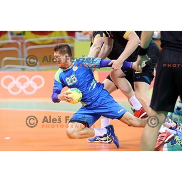 Marko Bezjak of Slovenia in action during Olympic handball tournament match between Slovenia and Germany in Barra Olympic Park at Rio de Janeiro 2016 Olympic games , Brazil on August 13 , 2016