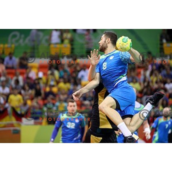 Blaz Janc of Slovenia in action during Olympic handball tournament match between Slovenia and Germany in Barra Olympic Park at Rio de Janeiro 2016 Olympic games , Brazil on August 13 , 2016