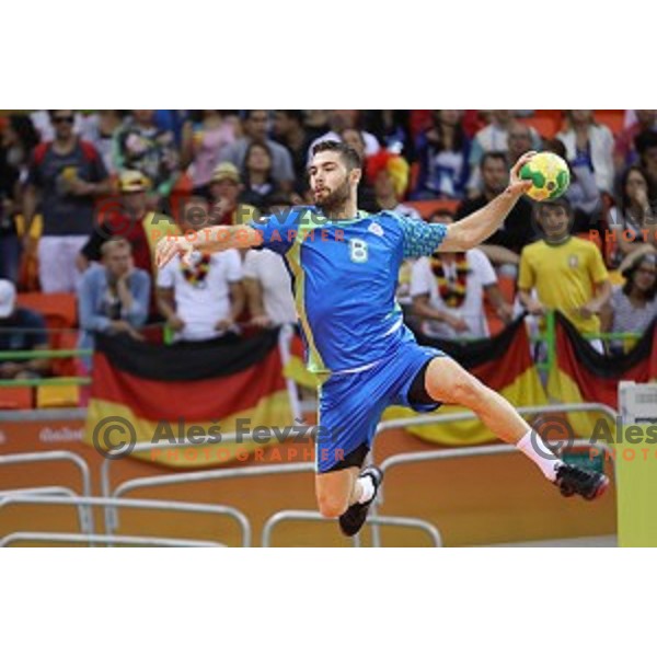 Blaz Janc of Slovenia in action during Olympic handball tournament match between Slovenia and Germany in Barra Olympic Park at Rio de Janeiro 2016 Olympic games , Brazil on August 13 , 2016