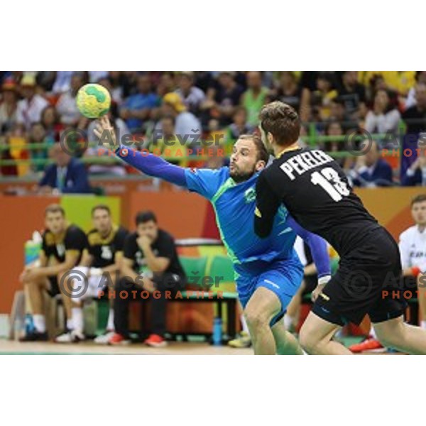 Uros Zorman of Slovenia in action during Olympic handball tournament match between Slovenia and Germany in Barra Olympic Park at Rio de Janeiro 2016 Olympic games , Brazil on August 13 , 2016