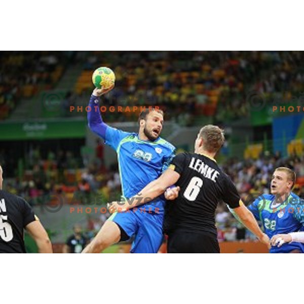 Uros Zorman of Slovenia in action during Olympic handball tournament match between Slovenia and Germany in Barra Olympic Park at Rio de Janeiro 2016 Olympic games , Brazil on August 13 , 2016