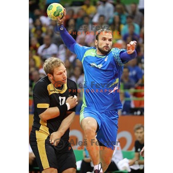 Uros Zorman of Slovenia in action during Olympic handball tournament match between Slovenia and Germany in Barra Olympic Park at Rio de Janeiro 2016 Olympic games , Brazil on August 13 , 2016