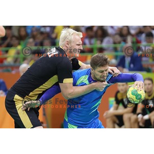 Marko Bezjak of Slovenia in action during Olympic handball tournament match between Slovenia and Germany in Barra Olympic Park at Rio de Janeiro 2016 Olympic games , Brazil on August 13 , 2016