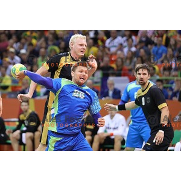 Marko Bezjak of Slovenia in action during Olympic handball tournament match between Slovenia and Germany in Barra Olympic Park at Rio de Janeiro 2016 Olympic games , Brazil on August 13 , 2016