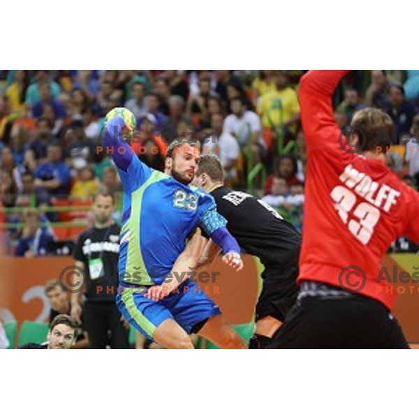 Uros Zorman of Slovenia in action during Olympic handball tournament match between Slovenia and Germany in Barra Olympic Park at Rio de Janeiro 2016 Olympic games , Brazil on August 13 , 2016