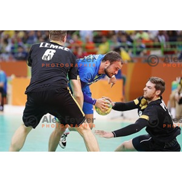 Uros Zorman of Slovenia in action during Olympic handball tournament match between Slovenia and Germany in Barra Olympic Park at Rio de Janeiro 2016 Olympic games , Brazil on August 13 , 2016