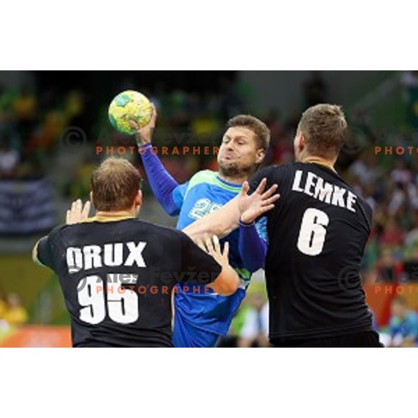 Marko Bezjak of Slovenia in action during Olympic handball tournament match between Slovenia and Germany in Barra Olympic Park at Rio de Janeiro 2016 Olympic games , Brazil on August 13 , 2016