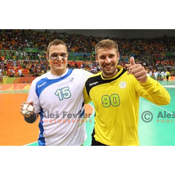 Vid Poteko and Urban Lesjak of Slovenia in action during Olympic handball tournament match between Slovenia and Poland in Barra Olympic Park at Rio de Janeiro 2016 Olympic games , Brazil on August 15 , 2016