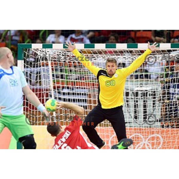 Urban Lesjak of Slovenia in action during Olympic handball tournament match between Slovenia and Poland in Barra Olympic Park at Rio de Janeiro 2016 Olympic games , Brazil on August 15 , 2016