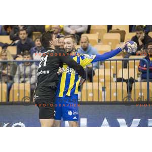 Gorenje’s left back Gregor Potocnik (21) and Celje’s right wing Gal Marguc (11) reacting during 10th round SEHA Gazprom League match between Celje PL and Gorenje Velenje in Zlatorog Hall, Celje on November 15th, 2016