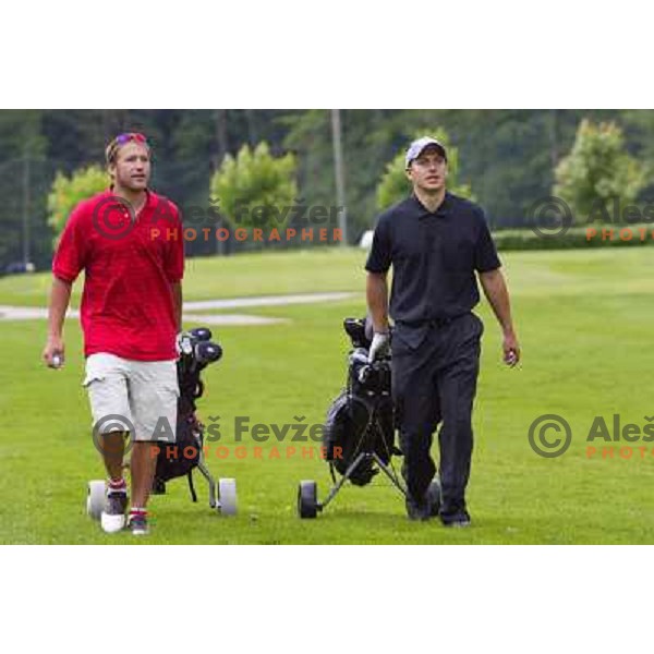 Miller Bode and Košir Jure walking to the first green atb Arboretum golf course