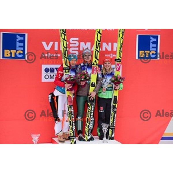 Second placed Daniela Iraschko Stolz (AUT), winner Maren Lundby (NOR) and third placed Kataharina Althaus (GER) at FIS Ski jumping Ladies World Cup in Ljubno, Slovenia on February 13, 2016