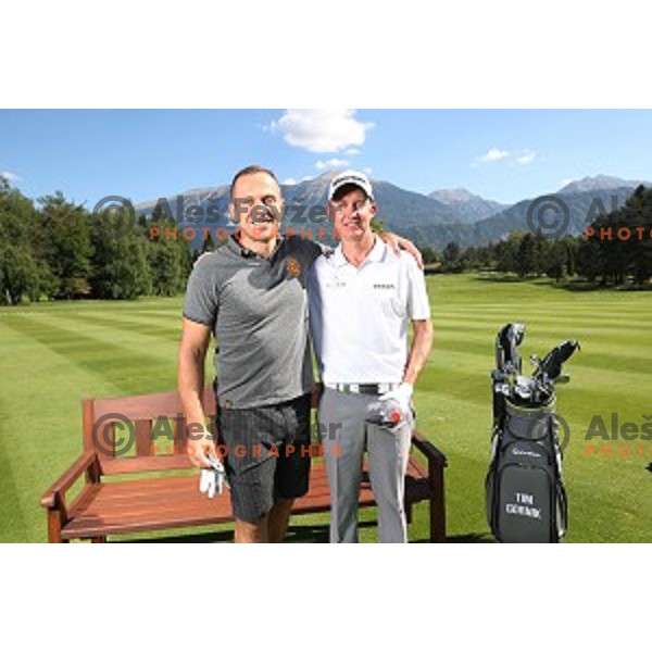 Jure Kosir meets professional golfer Tim Gornik of Slovenia during his practice at Bled Royal golf course on May 26, 2017